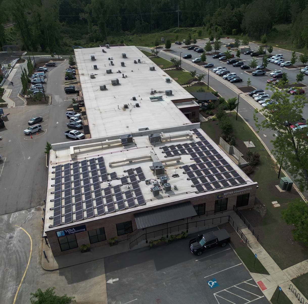 Commercial roofing professionals performing preventative roof maintenance
